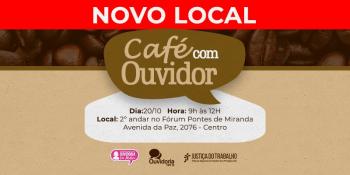 imagem de sementes de café com um balão na frentes escrito café com ouvidor e uma tarja escrita novo local
