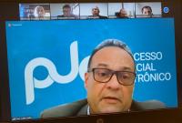 Tela da tranmissão da audiência de dissídio, no destaque o desembargador João Leite e em quadros menores, advogados do Hospital Santório, dos sindicalistas e o representante do MPT