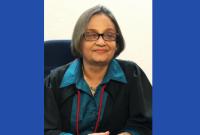 Foto da desembargadora Eliane Arôxa com toga preta e blusa azul