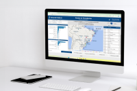Um computador com a imagem de uma mapa do Brasil e diversos gráficos