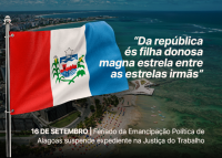 Bandeira de Alagoas tremulando com vista aérea do litoral de Maceió ao fundo. À direita, a frase: “Da república és filha donosa magna estrela entre as estrelas irmãs”. Na parte inferior, aviso sobre o feriado de 16 de setembro e a logomarca da Justiça do Trabalho da 19ª Região.