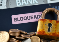 moedas, um cadeado e a palavra bloqueado