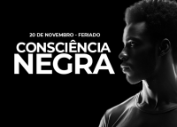 Card de fundo escuro com letras brancas. Há um um homem negro de perfil. Tem escrito Feraido Consciência Negra
