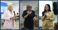 Há três mulheres.Cada uma delas está com um microfone na mão. Elas parecem falar para um público